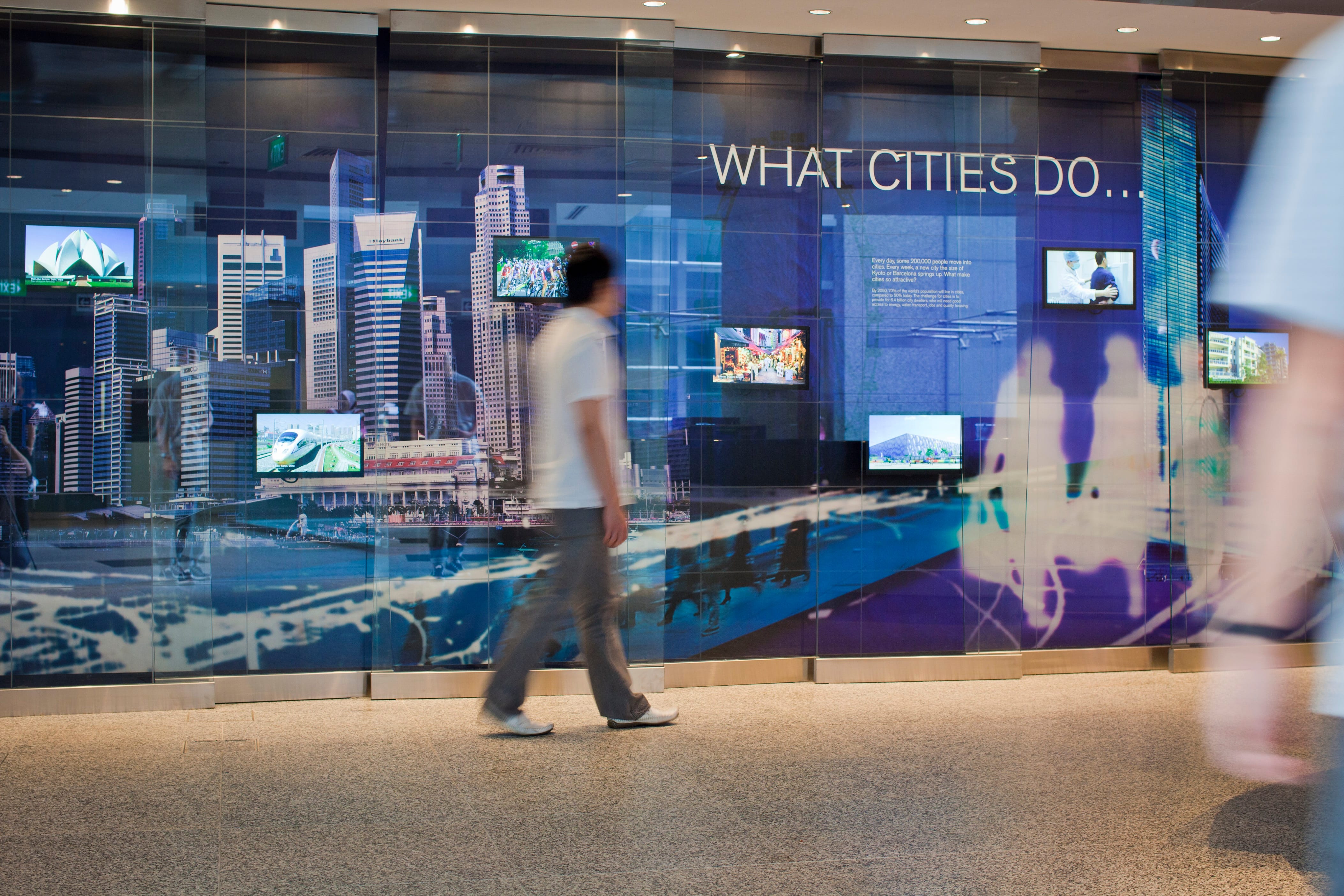 Man walking past an exhibition